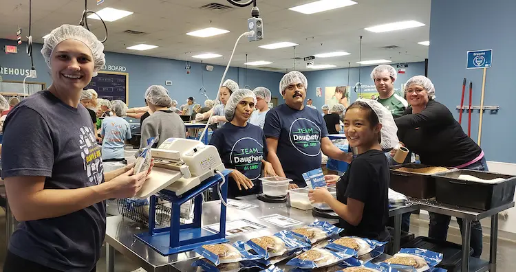 Volunteers helping prepare meals