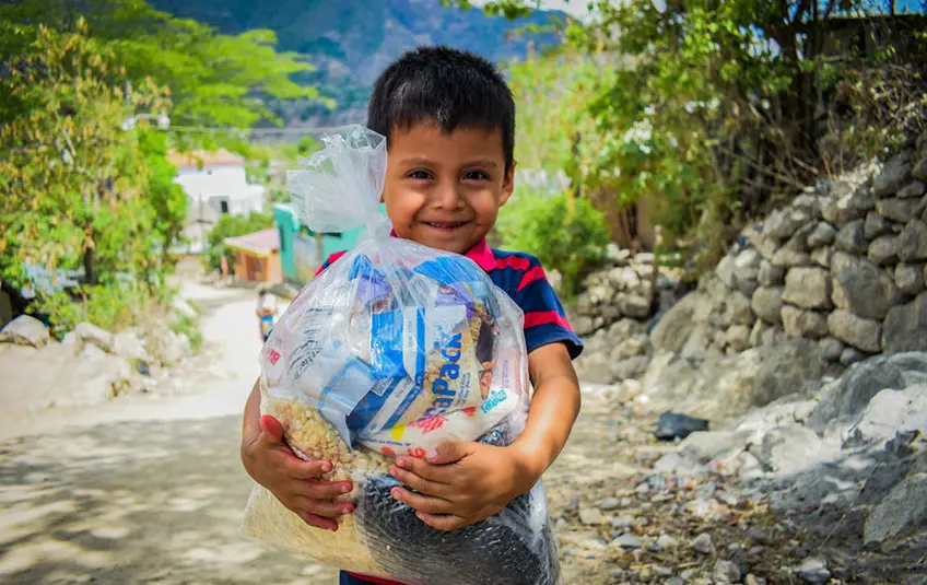 Kid with donated food
